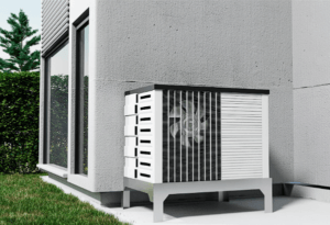 A white electric heat pump placed on the backdoor patio outside the house